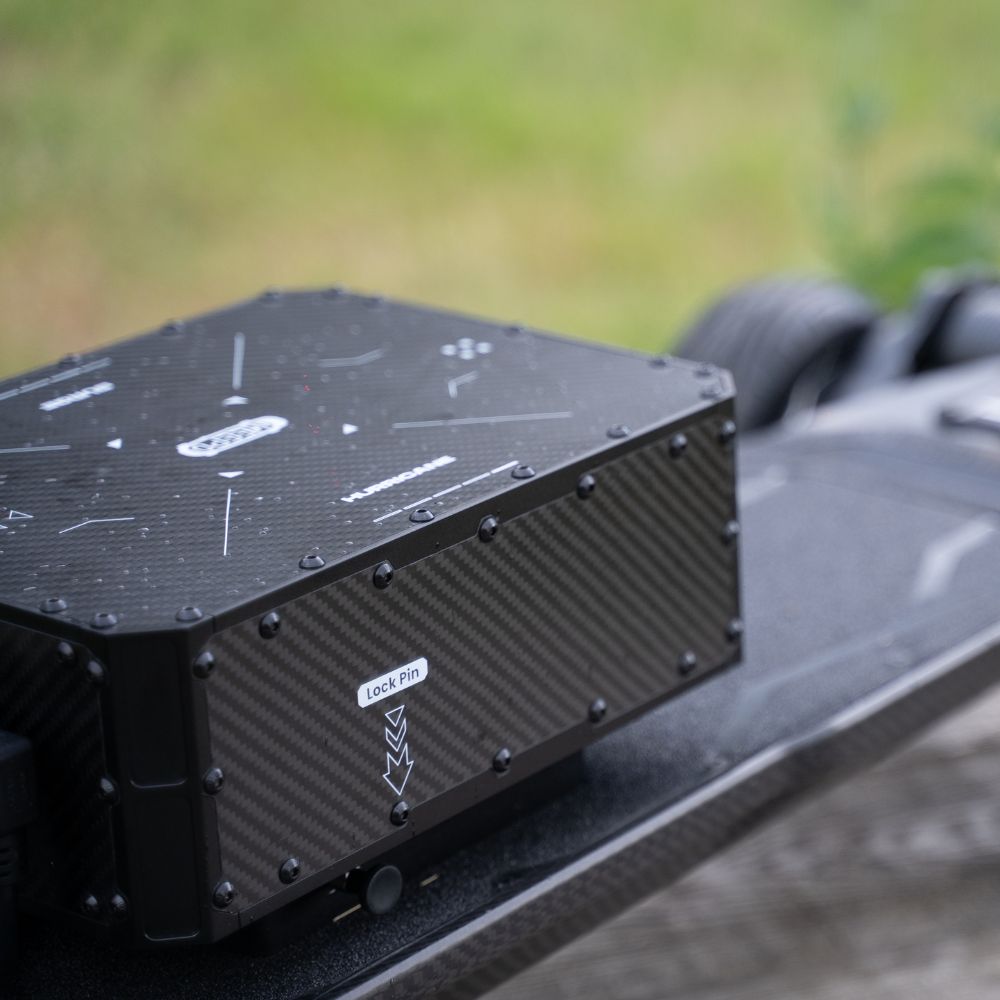 Close-up of Meepo Vader Hurricane Pro AWD electric skateboard battery enclosure