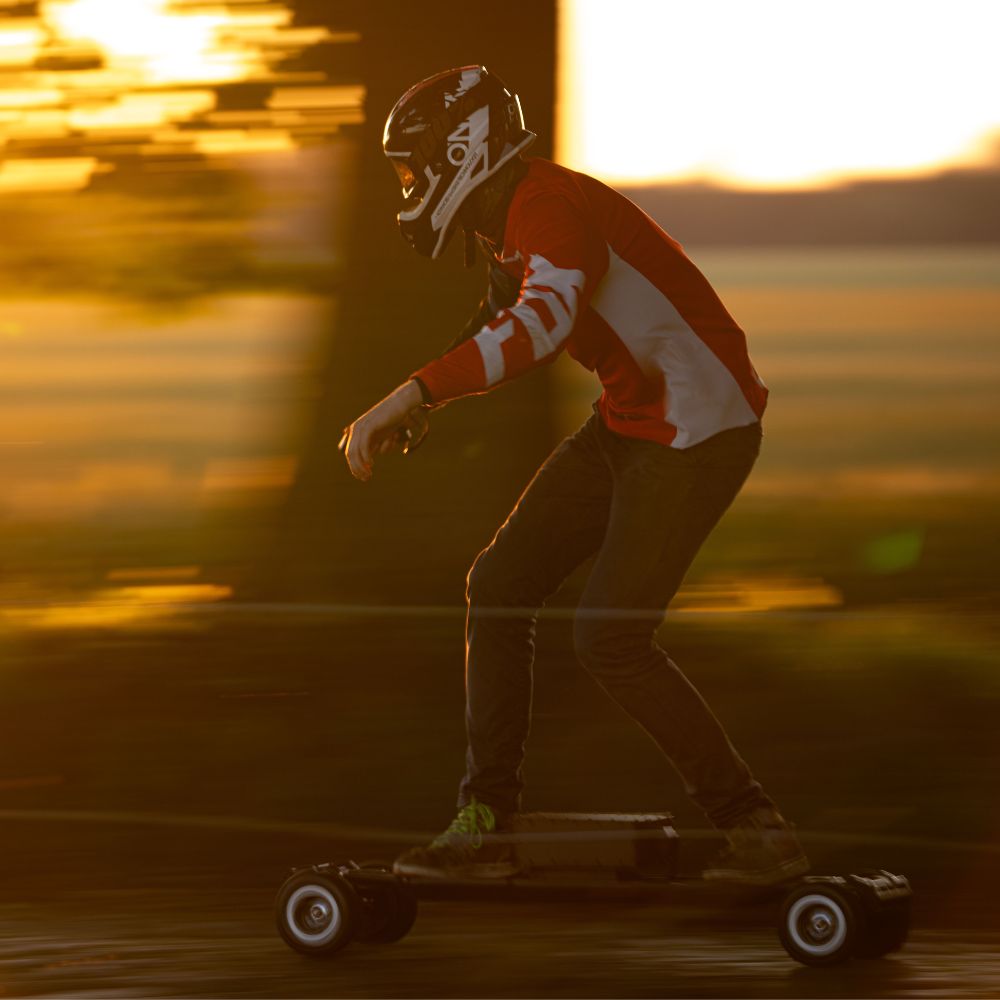 Rider navigating Meepo skateboard at sunset, showcasing agility and speed