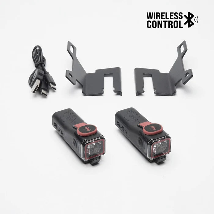 SL-R1+ skateboard brake lights with mounting brackets and USB-C charging cable