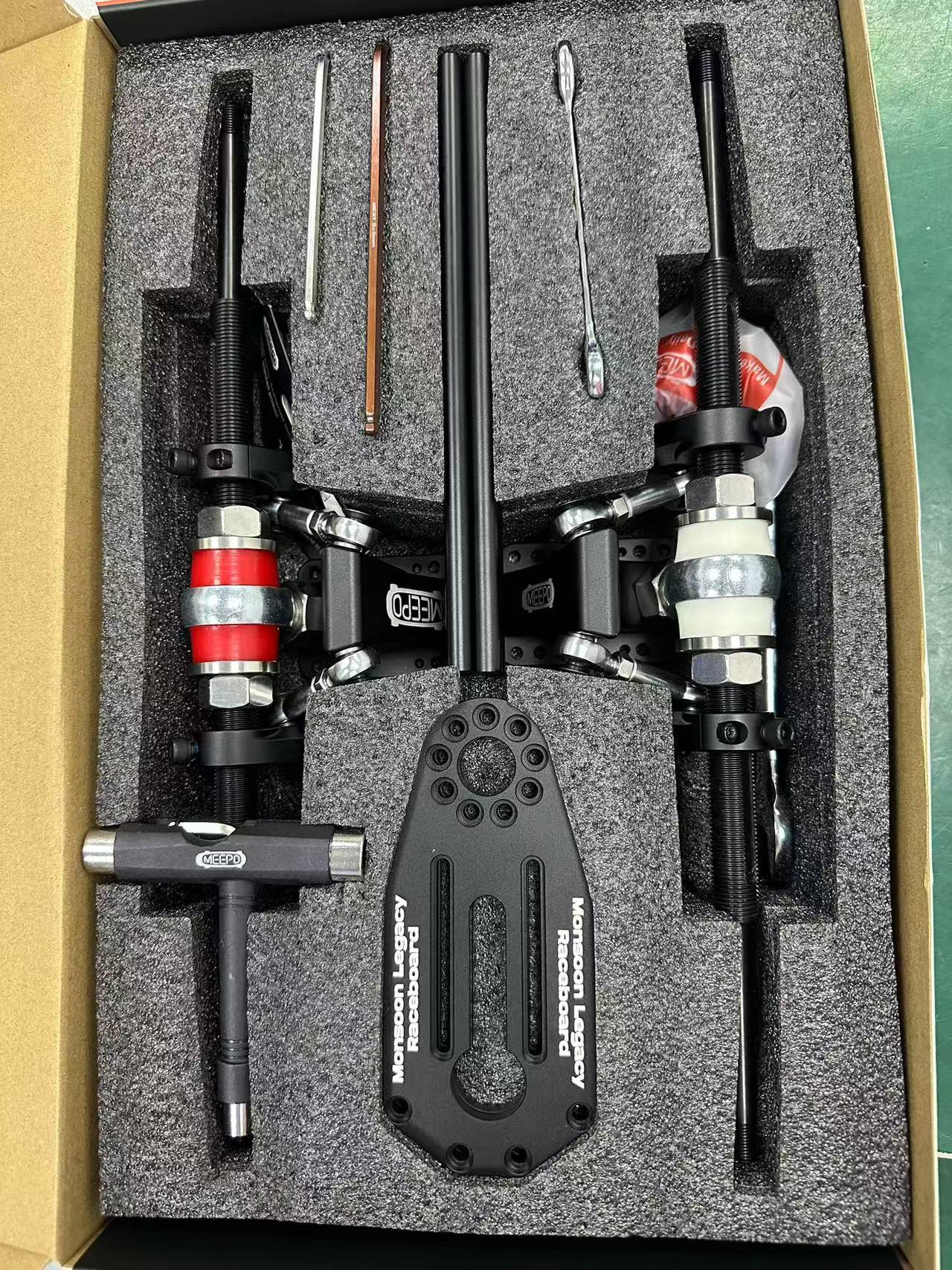 Meepo Monsoon Legacy Raceboard SRB 3 Link Truck chassis with tools in packaging.
