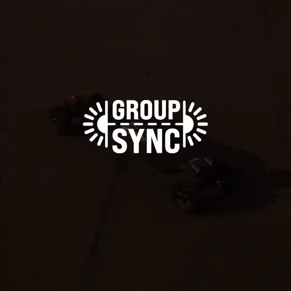 Group Sync logo with skateboard brake lights in low light