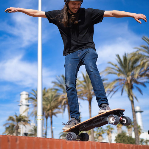 MEEPO MINI 5. This product is an electric skateboard featuring a compact, short-deck design with a black grip-tape surface and a dark-toned underside housing the battery and motor components