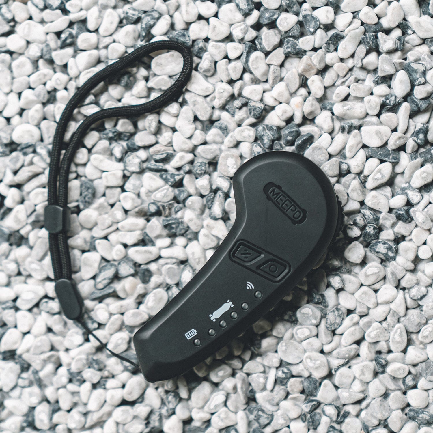 Meepo M5 remote for skateboards with control buttons and wrist strap.